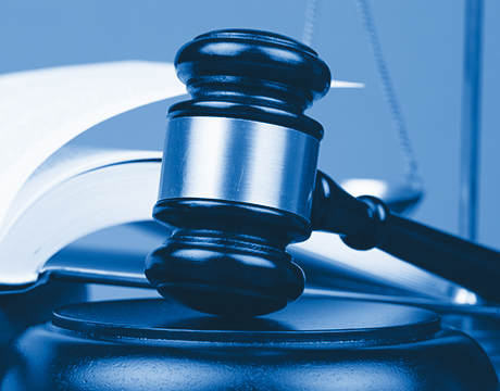 Photograph of a gavel with a blue filter
